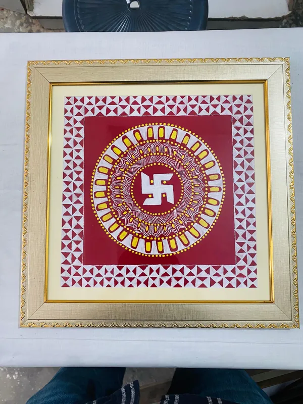 Swastik circle — An auspicious swastik within a detailed circular border