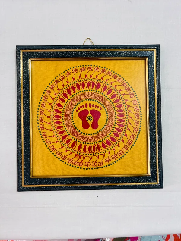 Golden footprints — A pair of footprints surrounded by concentric decorative rings