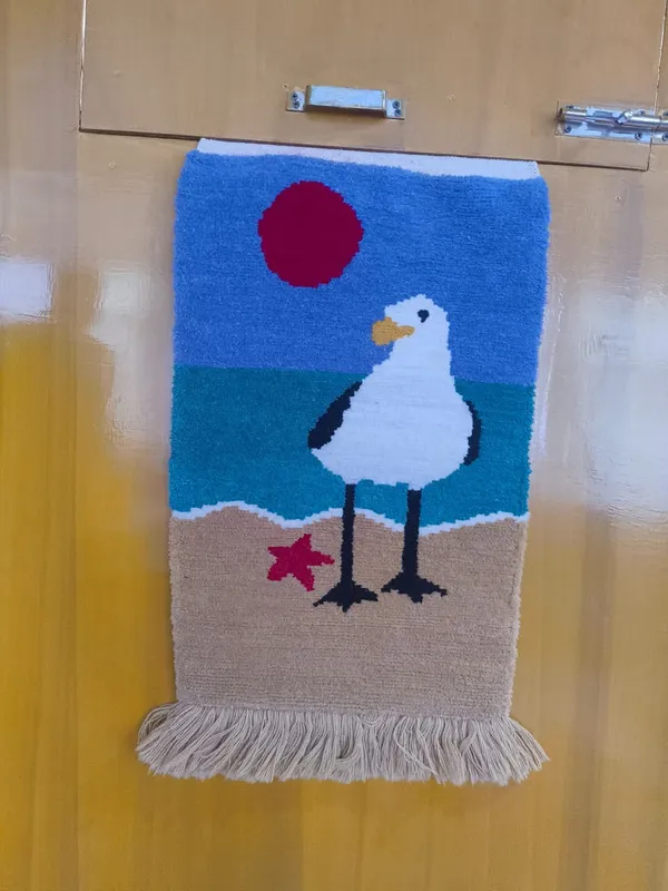 Gull on the shore — A gull, a red sun, a starfish