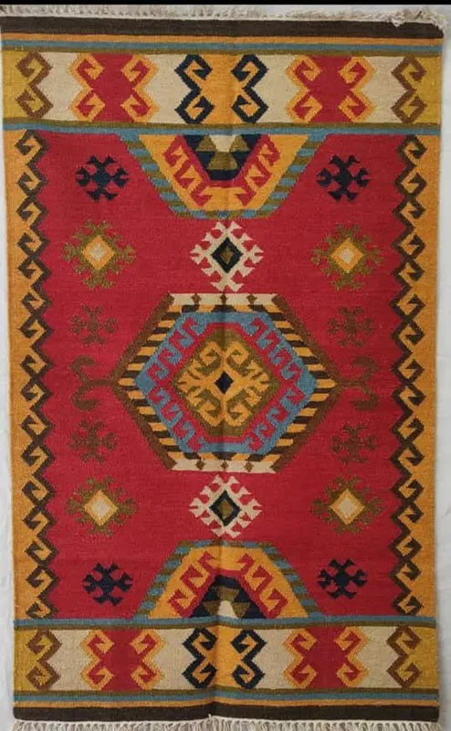 Scarlet medallion — A long red field with a diamond medallion and angular motifs