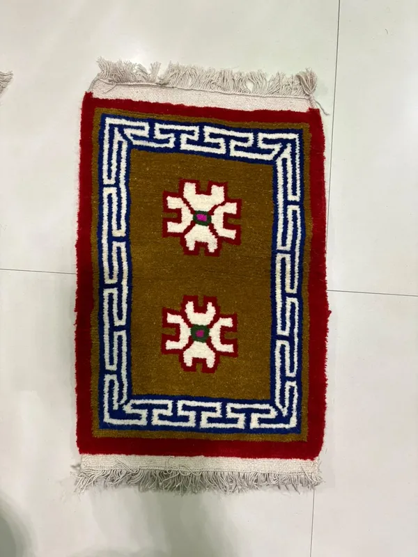 Twin stars — Two pale star motifs inside a geometric border
